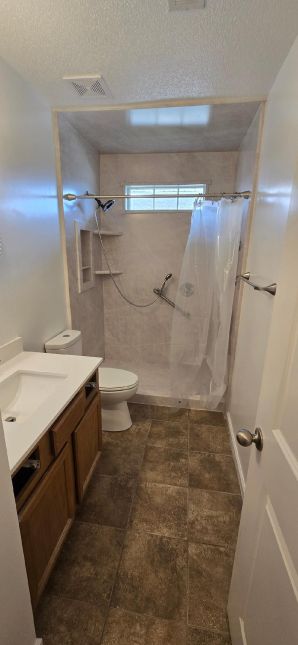 Bathroom remodel in Wetumpka, AL ( Charlie Jr., Mike, & Landon) Tub to Shower Conversion, New Vanity, and Paint Job , New Mirror and Lighting (3)