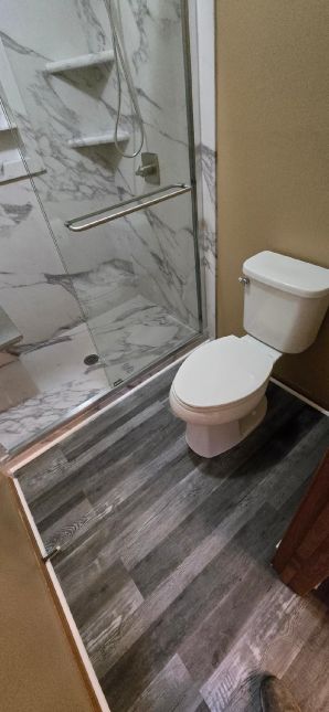Before & After Tub to Shower Conversion in Wetumpka, AL
(Charlie Jr and Mike)
New Luxury Bathroom Vinyl Flooring Installed (3)